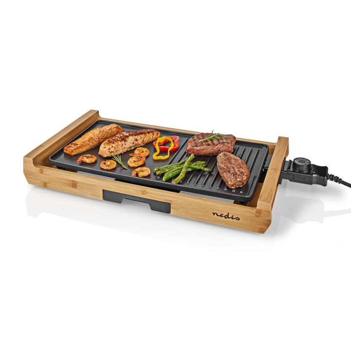 Nedis Teppanyaki Bordsgrill | Bakytan (l x b): 43 x 23 cm | Antal personer: 6 Personer | Non-stick beläggning | 4 Värmeinställningar i gruppen HEM, HUSHÅLL & TRÄDGÅRD / Hushållsmaskiner / Bänkspisar & Kokplattor hos TP E-commerce Nordic AB (C08138)